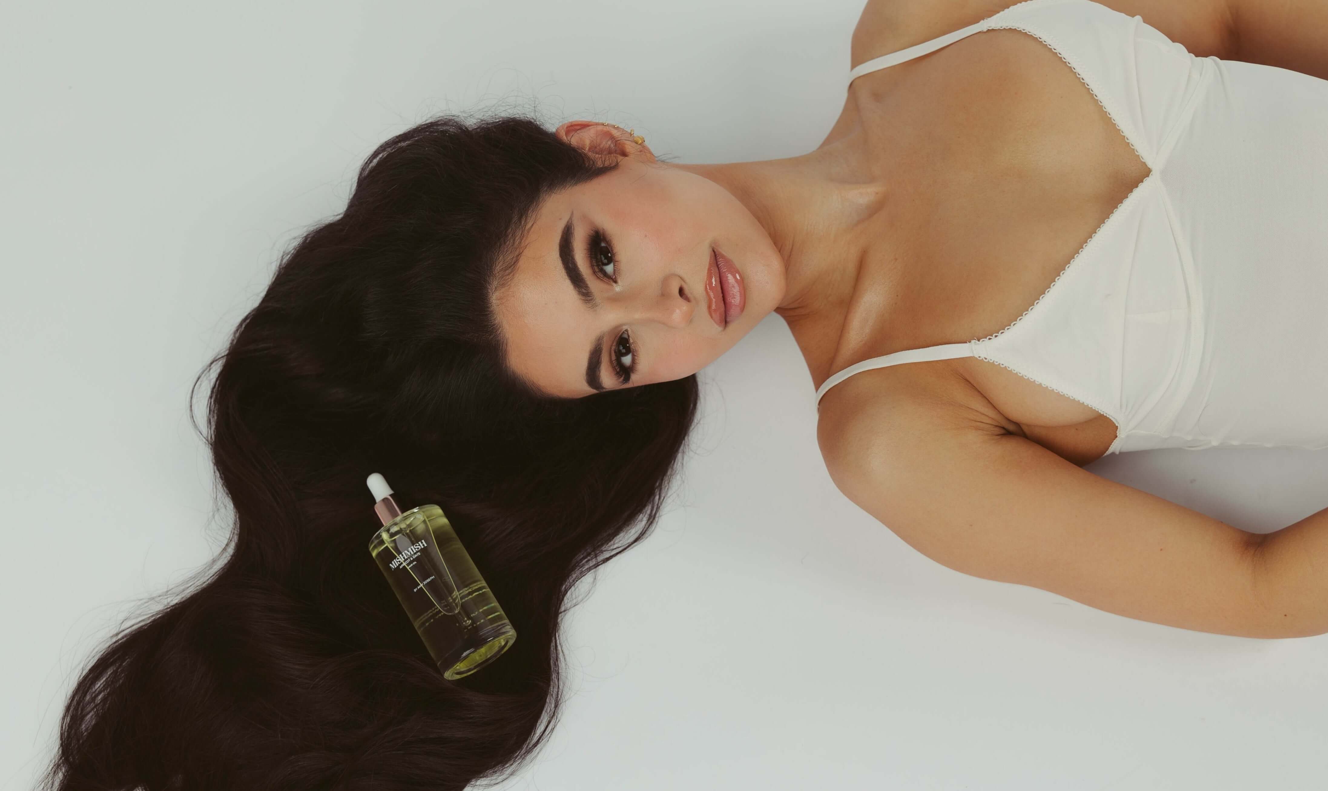 MishMish Brands founder Amy Joseph with the 100ml Apricot and Date hair oil